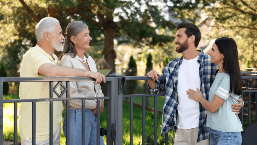 A family exploring a neighborhood and talking to a local resident for First Time Home Buyers