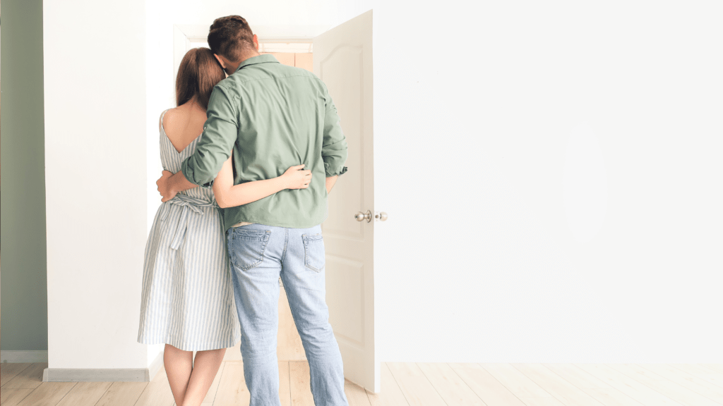 Couple conducting a final walkthrough of their new home for first time home buyers